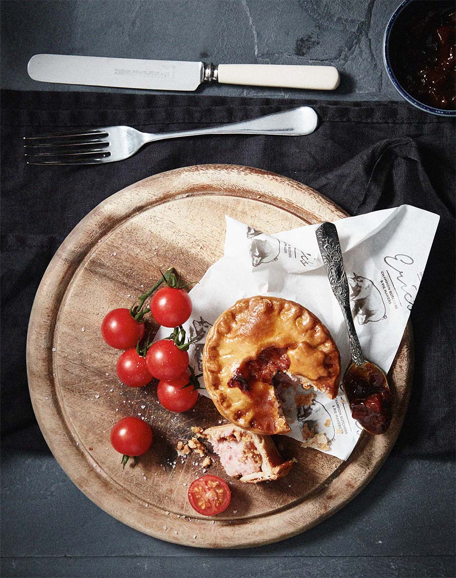 Pies & Tomatoes on Chopping Board